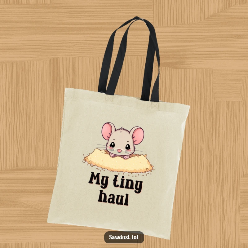 Funny Tote Bag showcasing a tiny mouse peeking from a dusting of sawdust, symbolizing hidden treasures and shy curiosity.